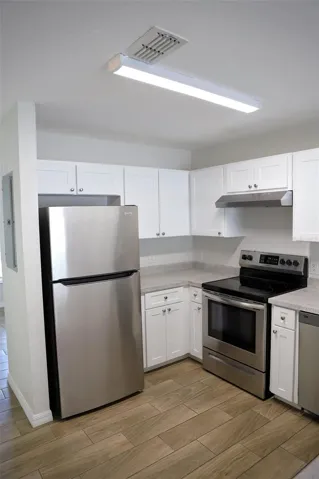 UNIT 230, beautifully update stainless appliances , wood look tile flooring through out, 3 bedroom 2 bath