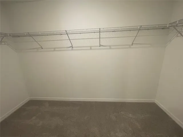 WALK IN CLOSET PRIMARY BEDROOM