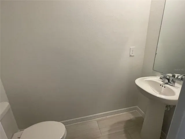 HALF BATHROOM NEAR ENTRANCE