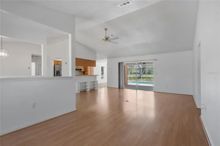 Sitting area / imagination room space leading to open family room and kitchen beyond.