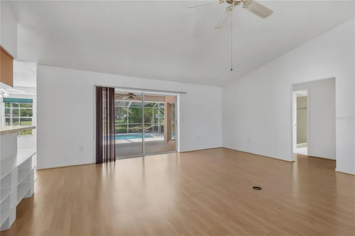 Family room with direct access to covered back patio and pool deck.