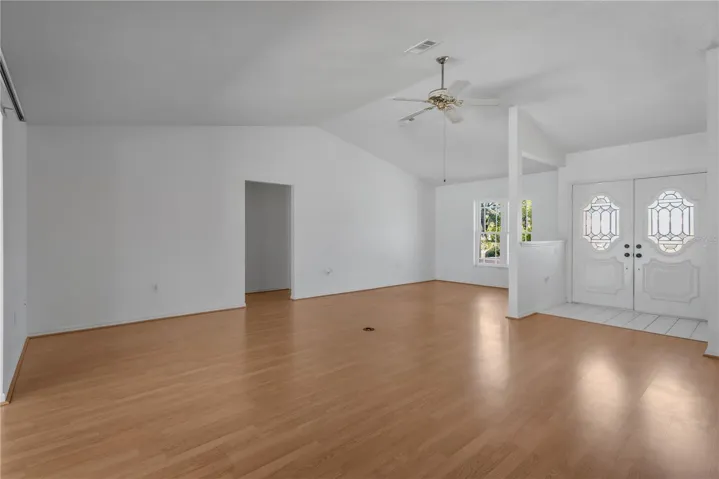 Grand entry with beautiful etched double doors welcomes you into this spacious, inviting home.