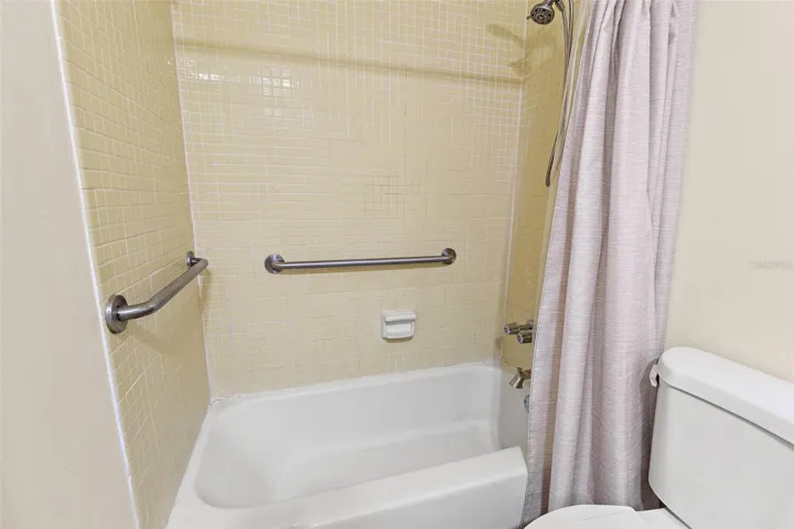 Bathroom tub/shower combo with tile surround