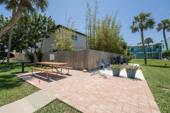 Community picnic area with brick paver patio and bike storage — Ocean Park South