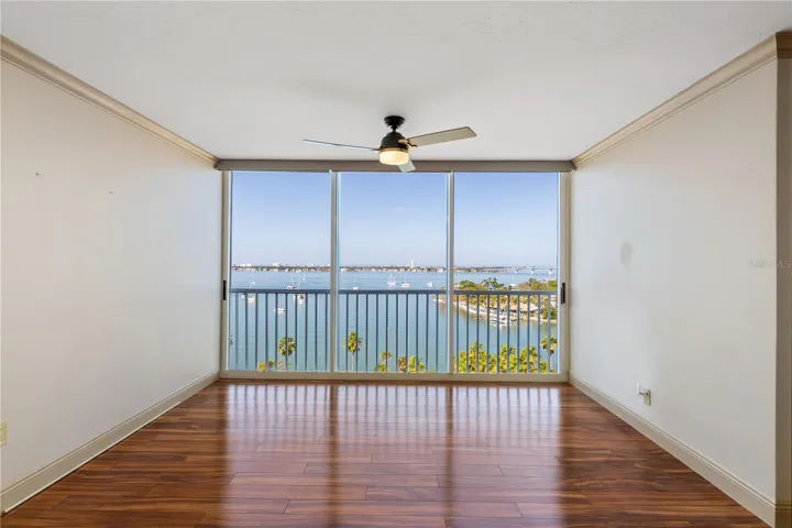 Floor-to-ceiling windows showcasing Sarasota Bay and the Ringling Bridge