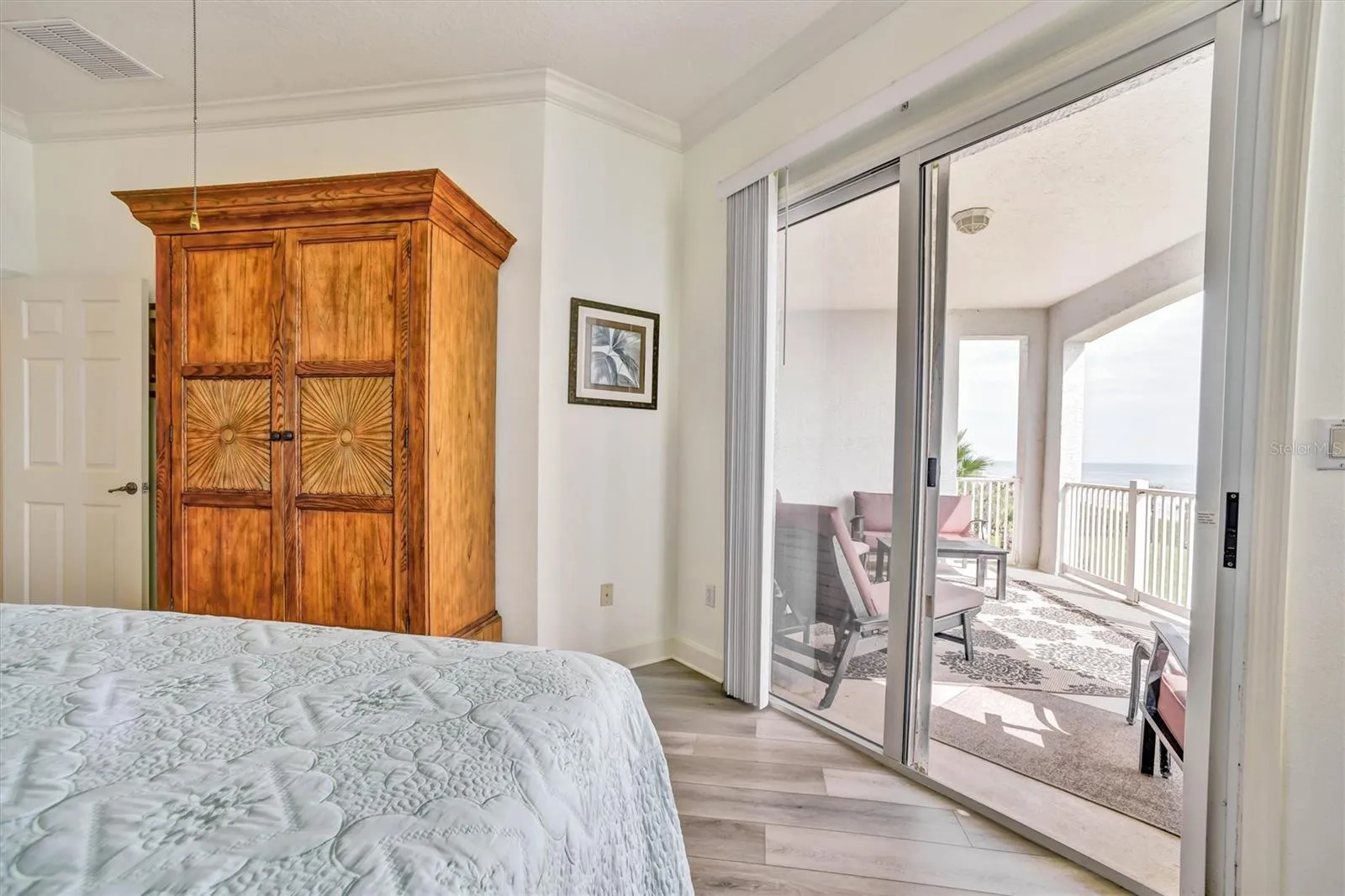 Primary bedroom private balcony entrance with fantastic beach view.