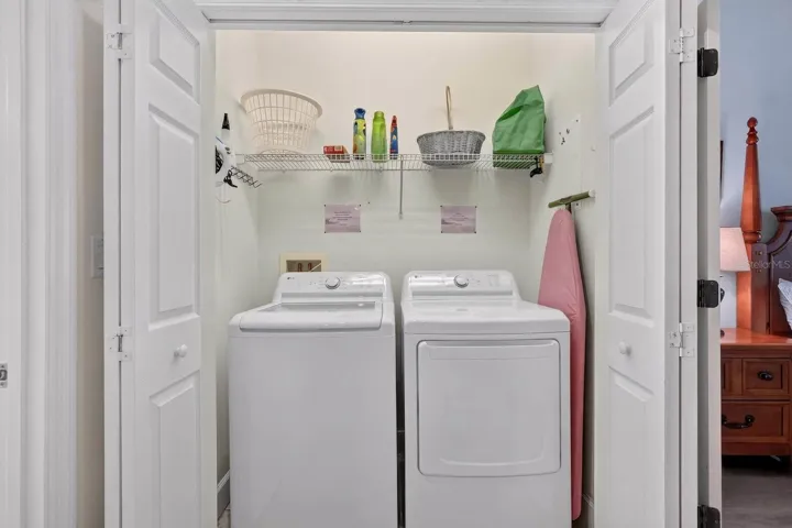 Inside Laundry with lots of storage features new washer & dryer.