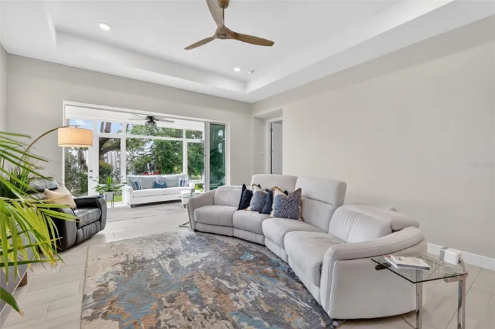 Expand the Great Room by opening the triple sliding doors onto the 4-season lanai.