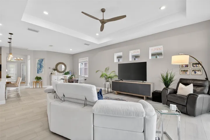The Open Concept Floor Plan, 12 ft Coffered Ceiling, Transom windows all add the modern touches of this lovely home.