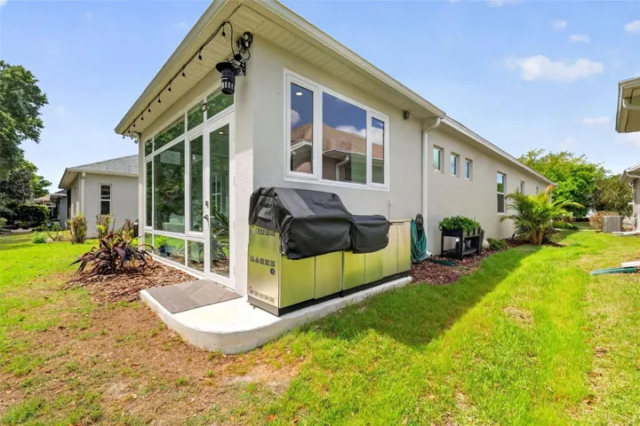 Gas grill and outdoor kitchen. Ask about conveyance.