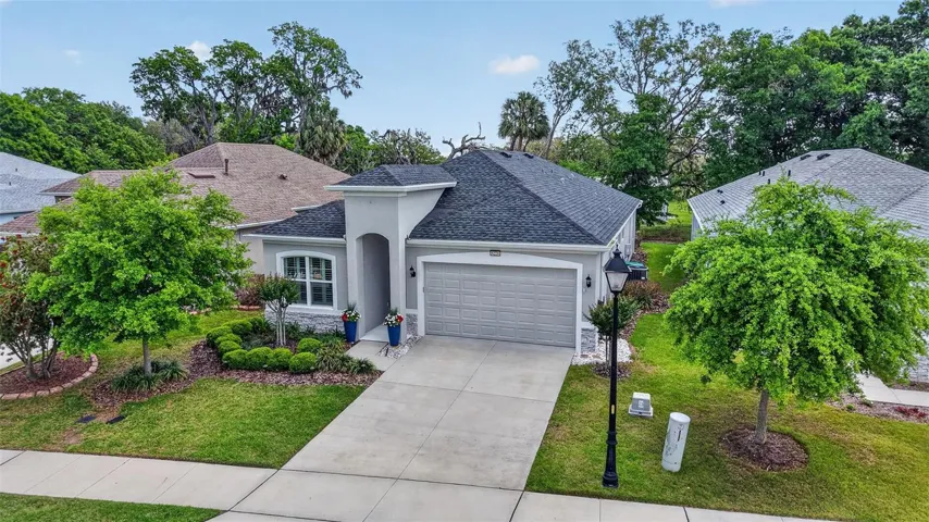 The mature shade tree and landscaping adds charm to this home.