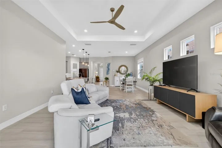 The Coffered ceiling adds volume while the neutral ceramic tile adds depth, two great design choices.