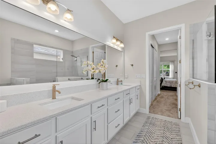The dual sinks are inset into ample vanities allowing for great storage and daily functionality.