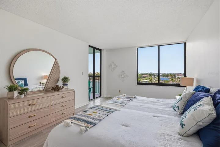 Primary bedroom with balcony access