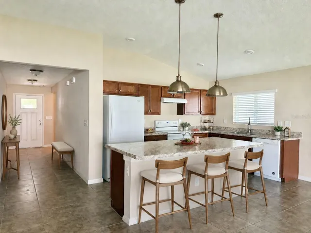 Staged: Foyer and Kitchen Area