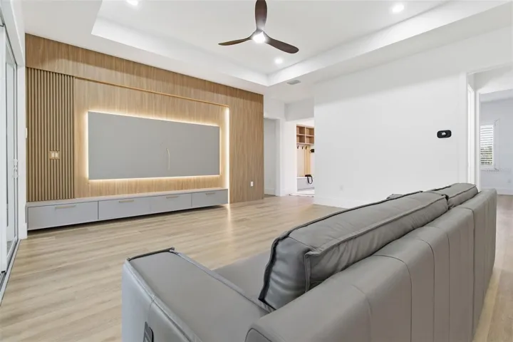 Open living room with custom TV feature wall