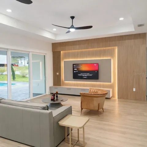 Modern living room with with furniture and pool view