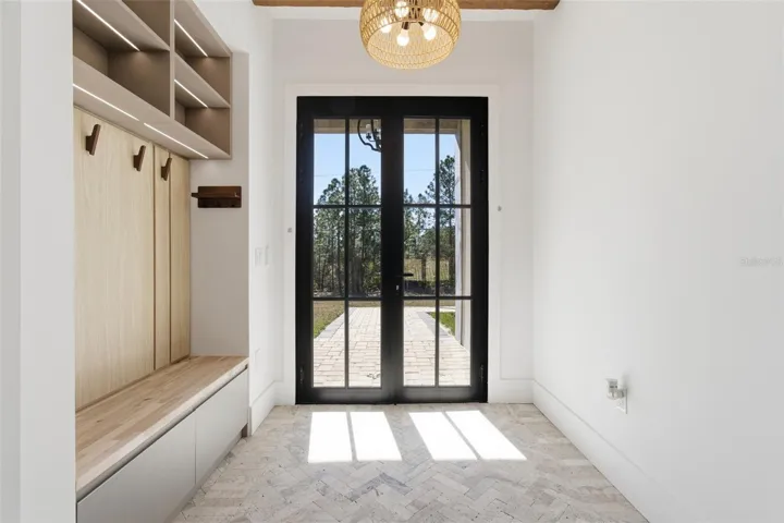 Foyer entry with built-in mudroom bench and storage