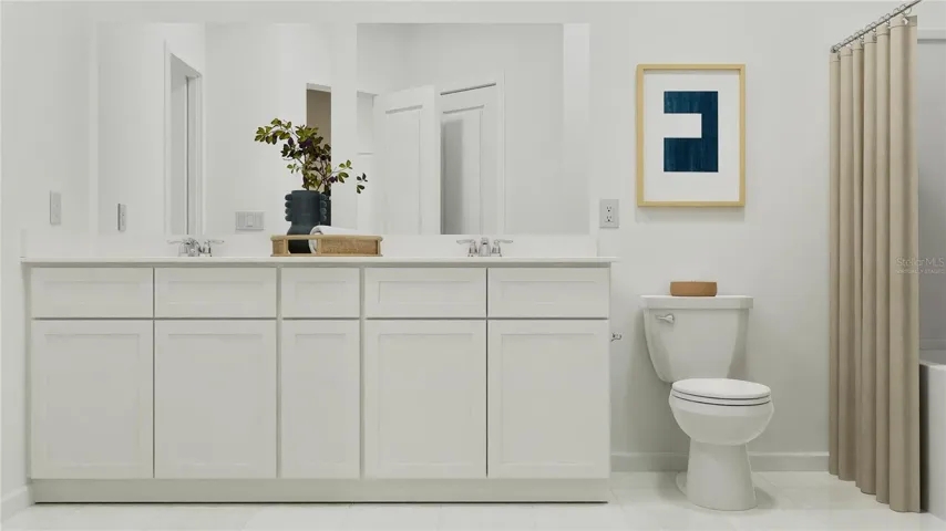 Virtually staged. Main bathroom suite