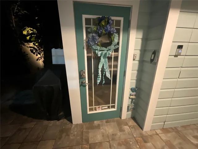 Entry to upstairs  apartment / kitchenette / secondary living quarters