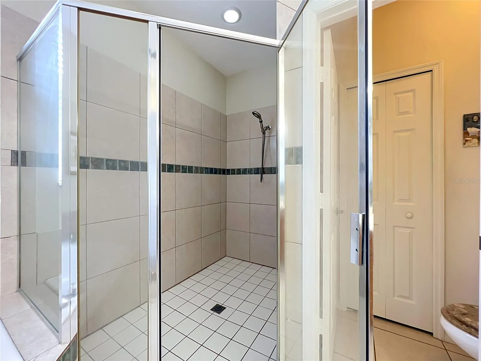 Shower and private water closet with linen