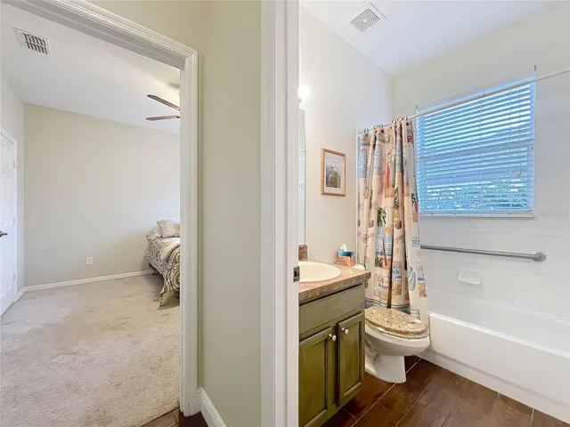 Hall looking into bath 2 and into bedroom 3