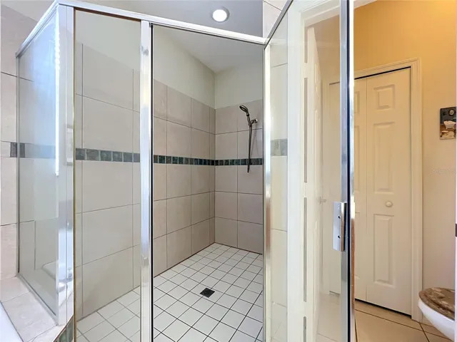 Shower and private water closet with linen
