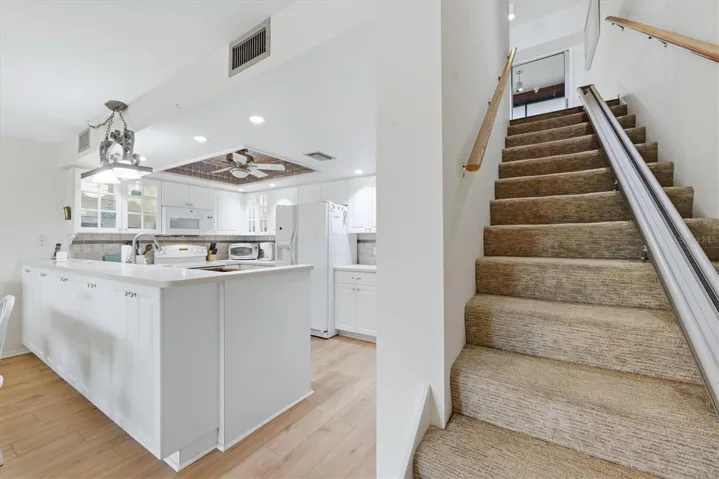 Kitchen & stairway to Master Bedroom.