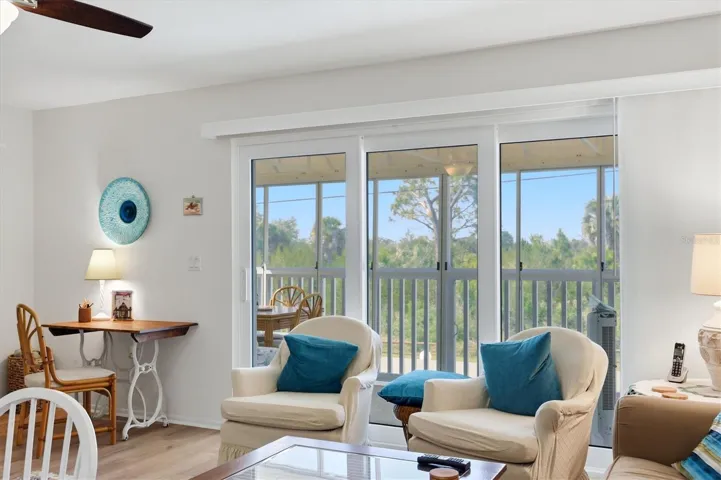 L/R with viewing Sliding Glass Doors to Screened in Front View Porch.