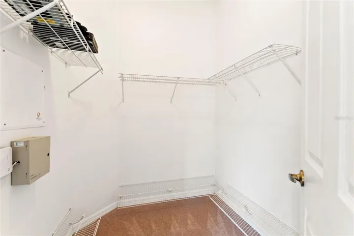 Walk in closet in primary bedroom