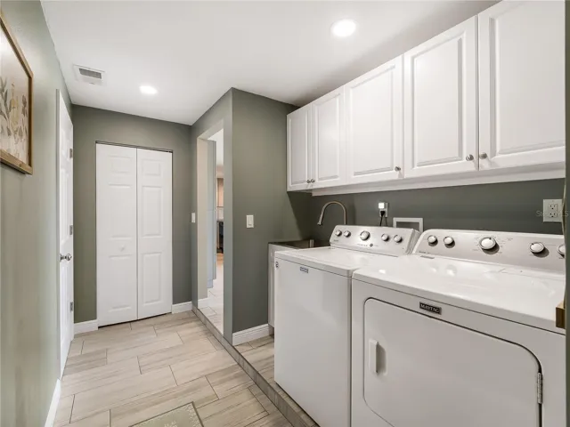 Laundry with storage closet