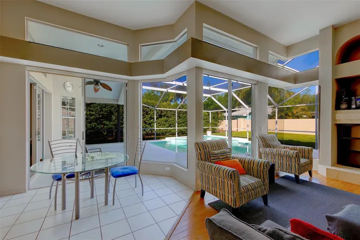 Light and bright family room with plenty of windows for natural light and dining area