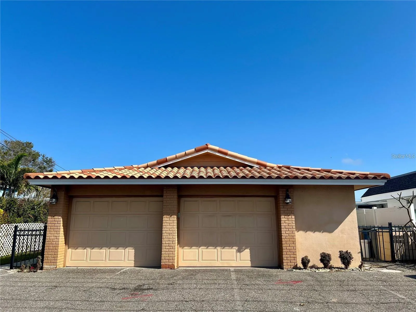 Waterfront Block construction building with hurricane windows and tile roof