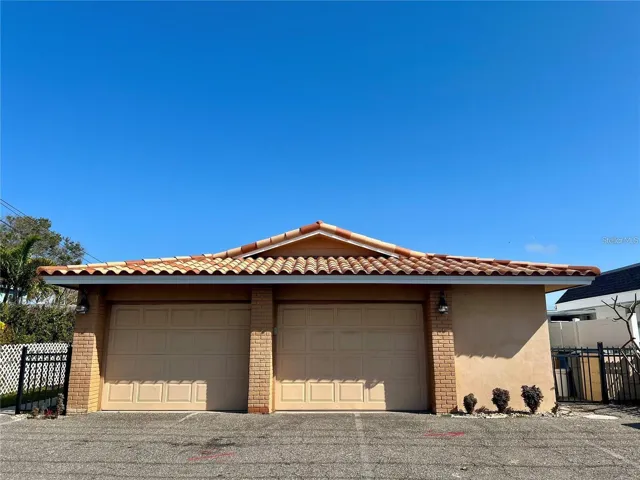 Waterfront Block construction building with hurricane windows and tile roof