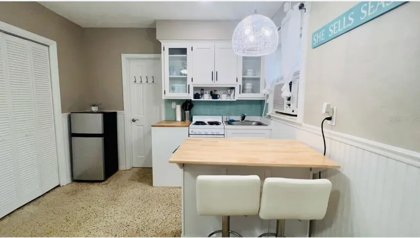 yellow studio back unit of 1760 wisconsin | 1761 Siesta Drive, 1760 & 1762 Wisconsin, Sarasota, FL 34239