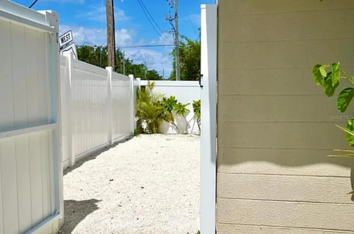 side front yard for 1761 siesta dr | 1761 Siesta Drive, 1760 & 1762 Wisconsin, Sarasota, FL 34239