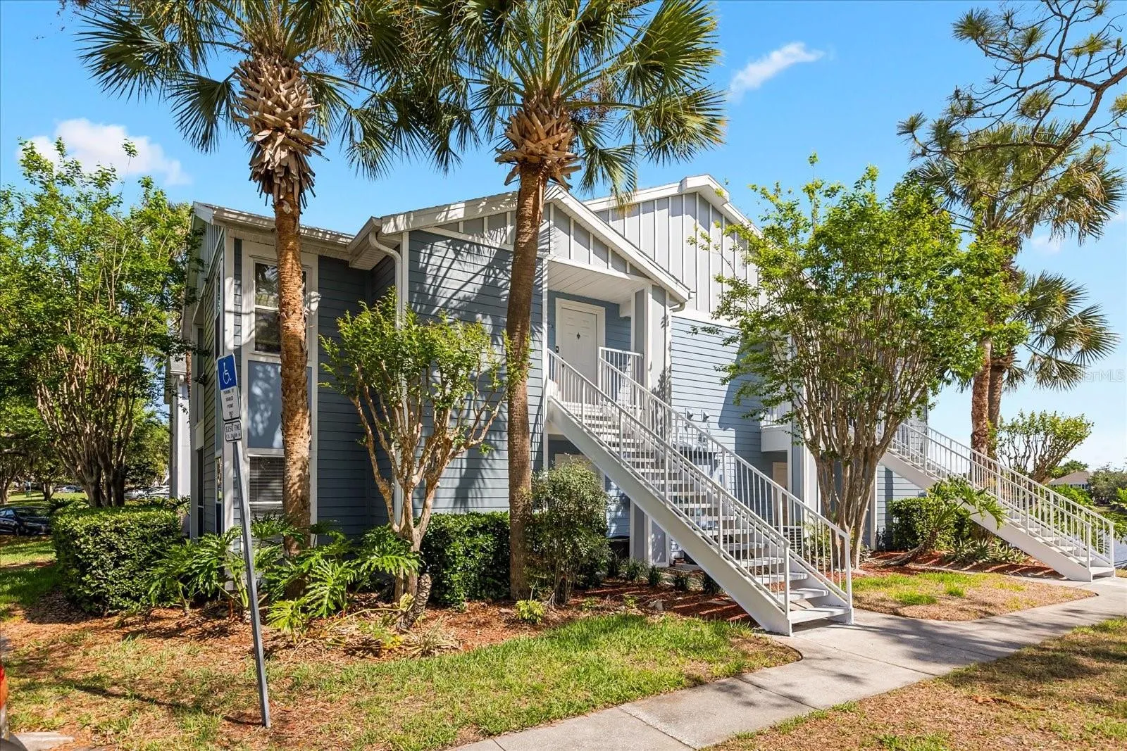 Walk way towards unit 103 on 1st floor.