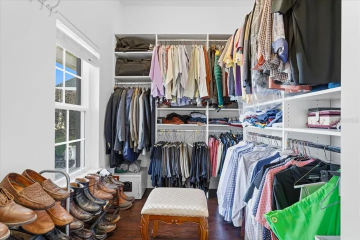 Primary bedroom walk-in closet