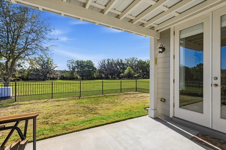 Covered Guest House lanai with fenced yard and generator