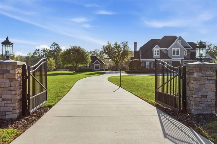 Double-gated estate home. Red Oaks Estates offers a gated community plus this residence has its own beautiful gate.