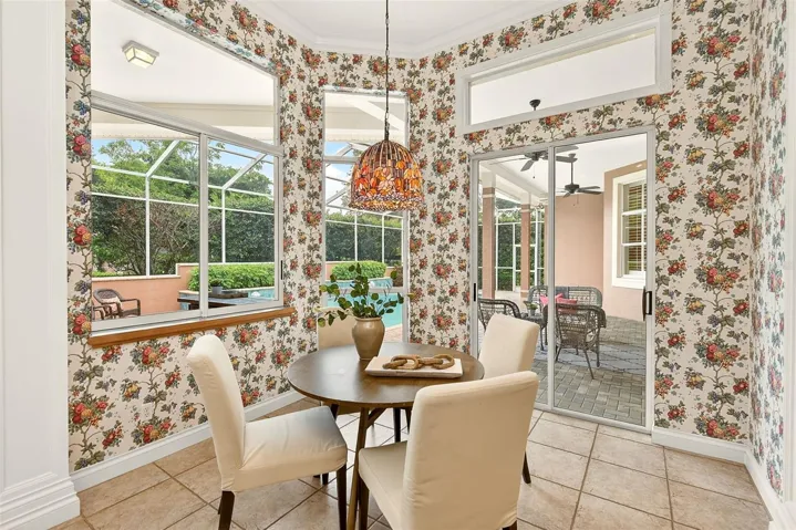 Dining area overlooking the pool and lanai.
