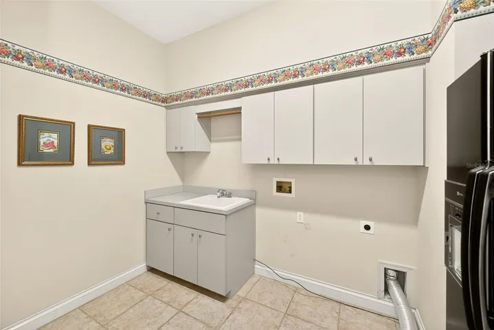Laundry/Mud Room with 2nd fridge and tons of storage.