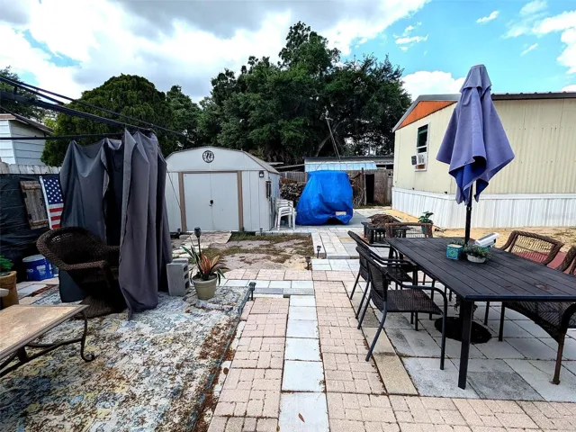 Spacious backyard offering ample storage space and room for outdoor entertaining.