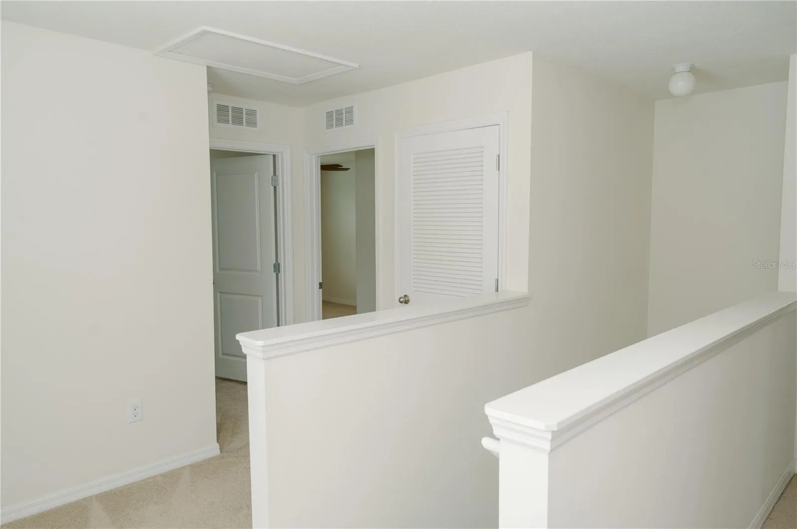 Top of stairway, 2nd floor. Looking towards air handler closet, bedrooms 1&amp;2