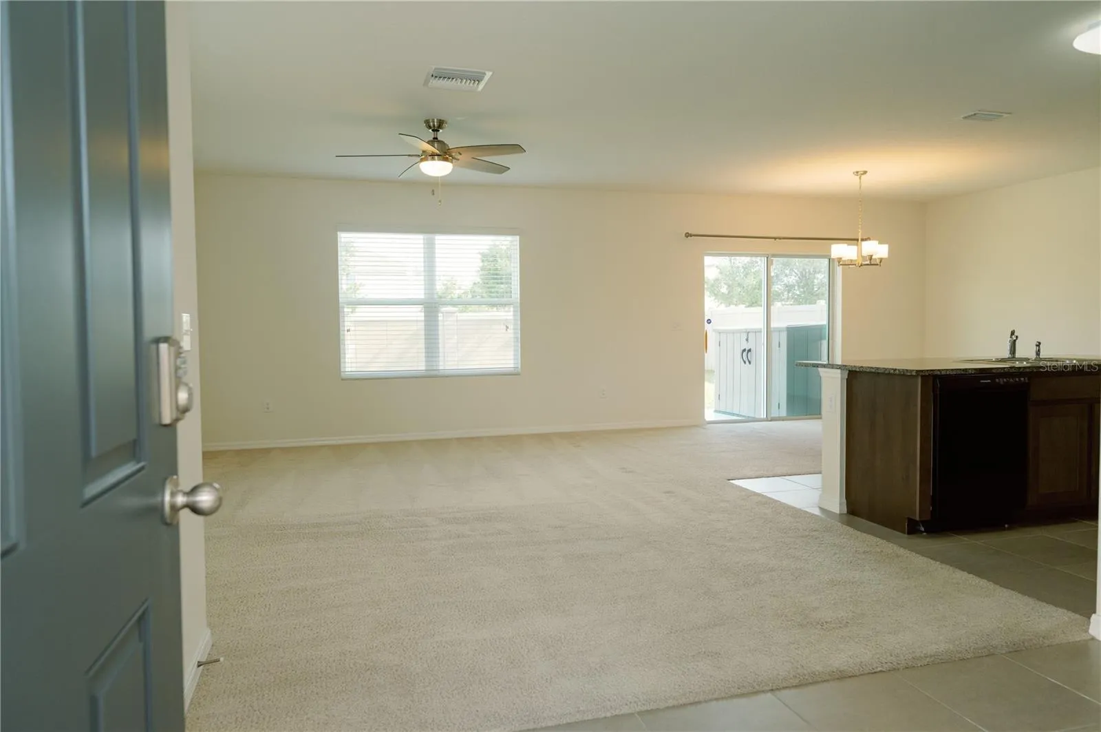 Livingroom, open concept combo with kitchen and dinning room from front door