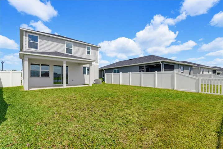 The private backyard is a blank canvas ready for your vision. Whether you envision a screened lanai, fire pit area, or tropical garden — the space is yours to create.