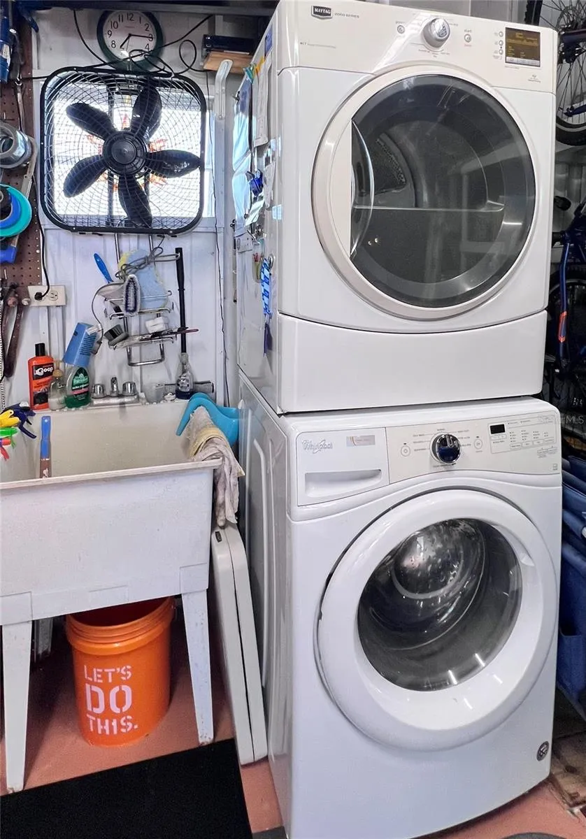 Full size stackable washer and dryer in shed