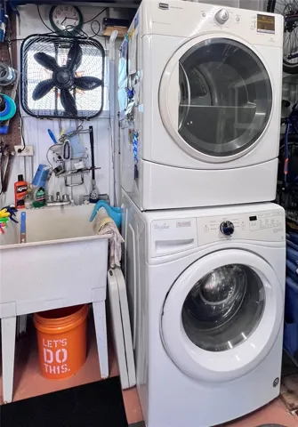 Full size stackable washer and dryer in shed