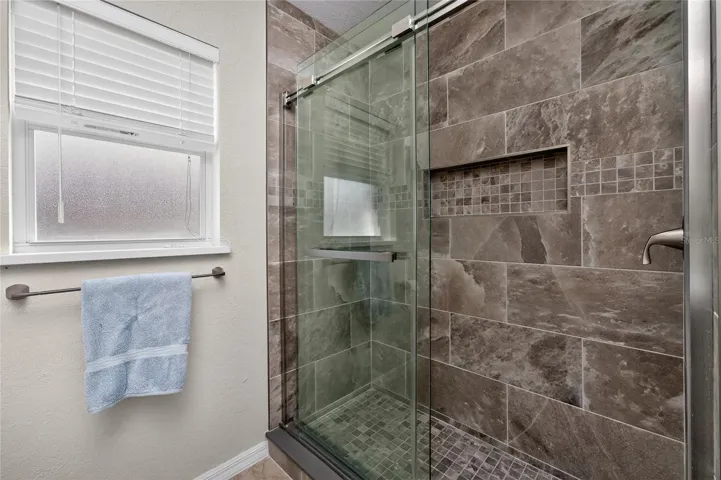 Guest bathroom - old tub was removed to make way for this gorgeous step in shower w/shower door.