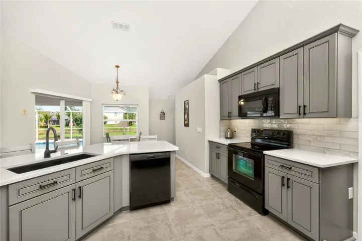Updated appliances complement the kitchen color palette.